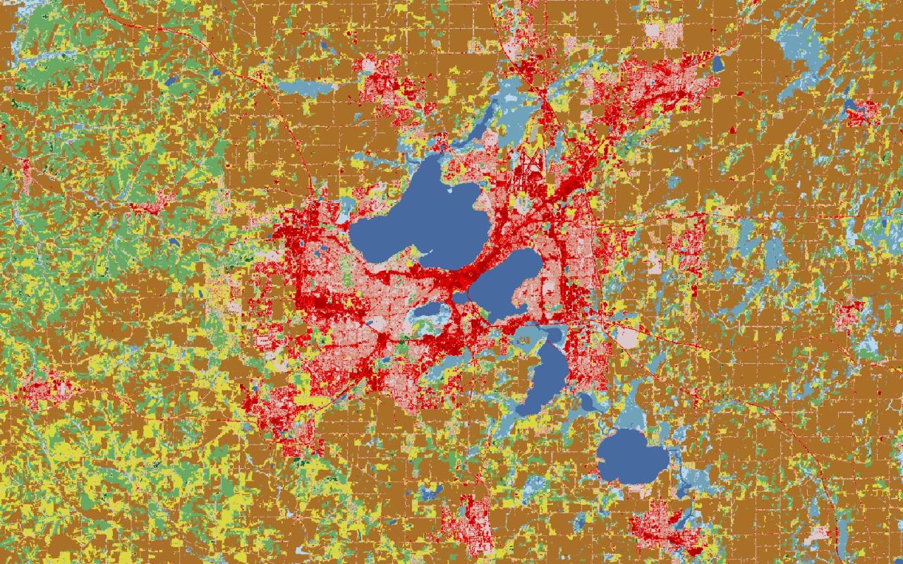 Land cover map of Madison, Wisconsin: lakes in blue, city in red, farmland in brown and yellow, forest in green